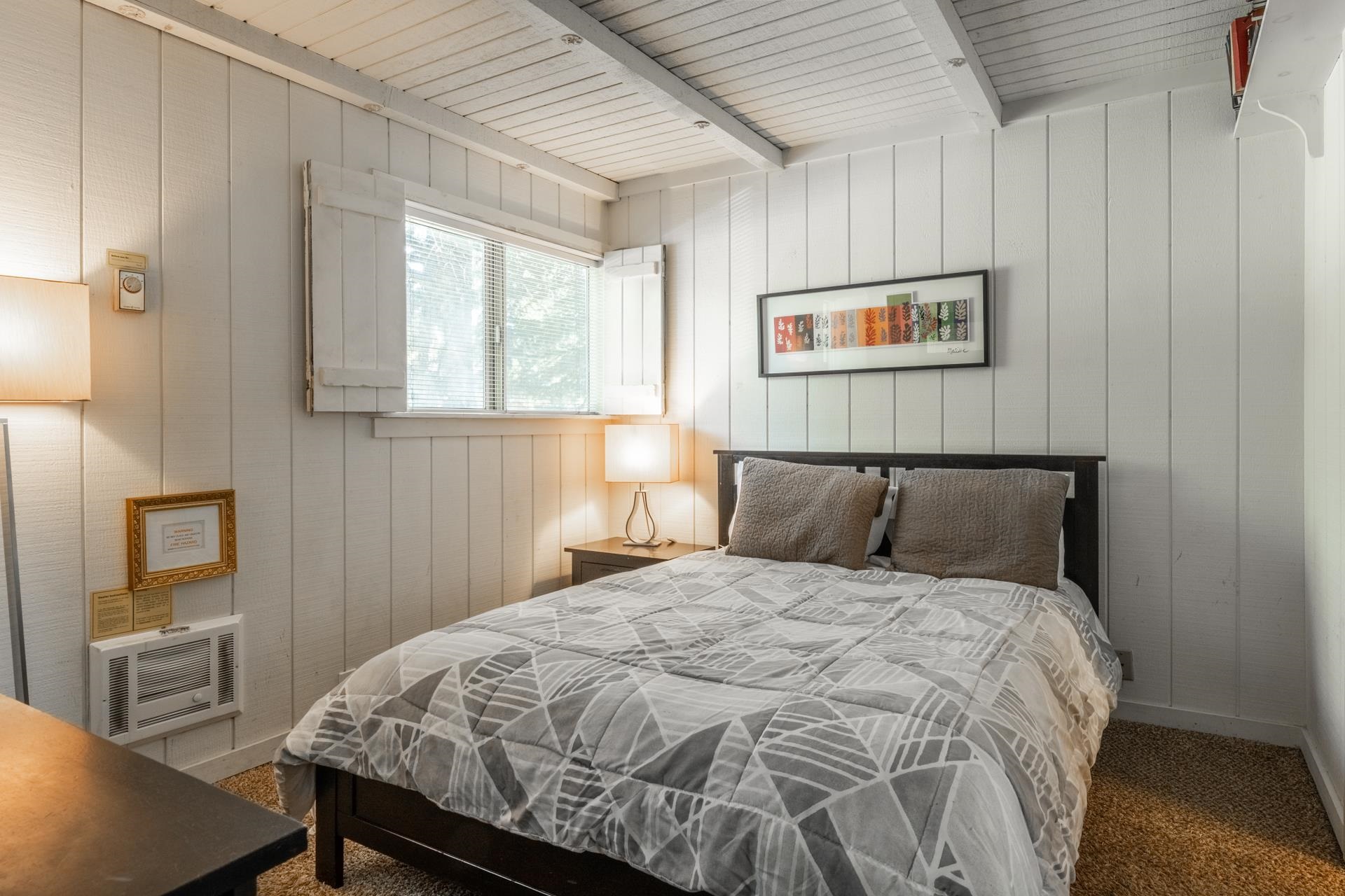 165 Old Mammoth Road, Unit 3 Mammoth Lakes, CA 93546 - Photo 16 of 48 White vertical plank wall paneling with exposed beam ceiling