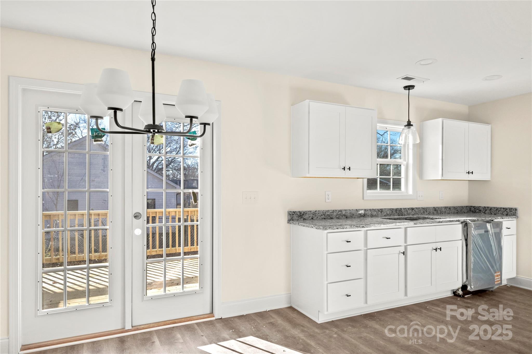 545 Washington Street Rock Hill, SC 29730 - Photo 7 of 25 a bathroom with a granite countertop sink and a mirror