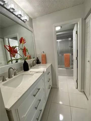 a view of a hallway with closet and utility room