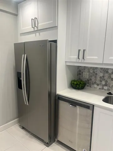 a kitchen with a stove and a microwave