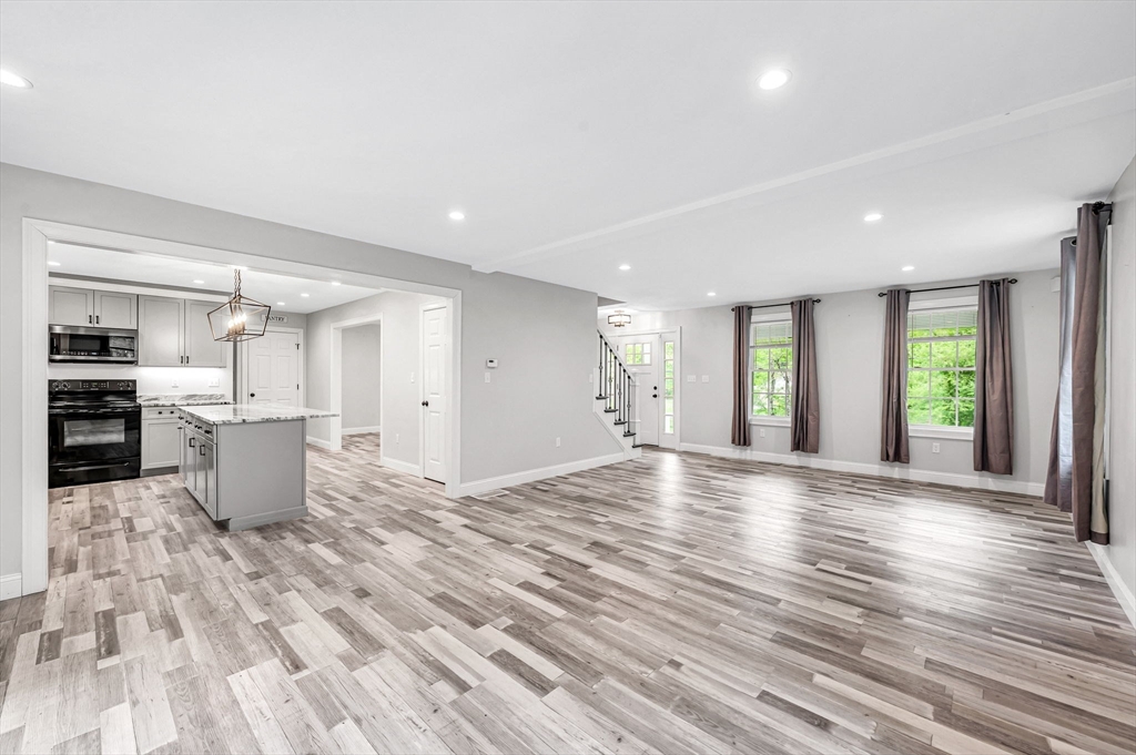 1310 North Brookfield Road Oakham, MA 01068 - Photo 14 of 30 a view of kitchen and hall with wooden floor
