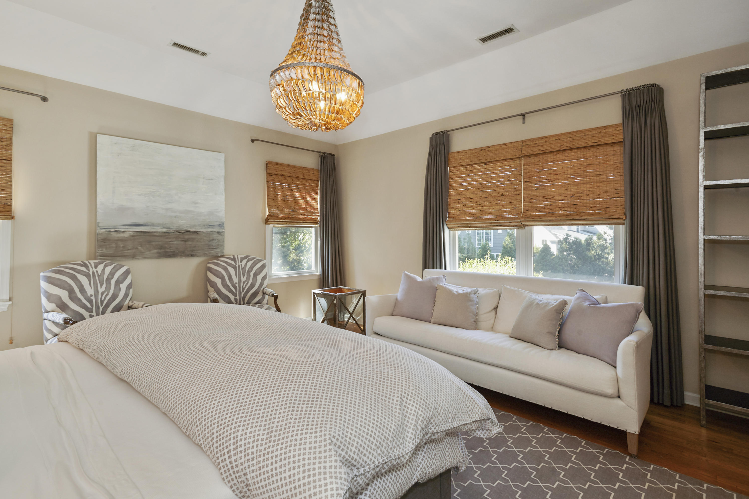 14 Richmond Road Rowayton, CT 06853 - Photo 12 of 28 a spacious bedroom with a bed and a chandelier