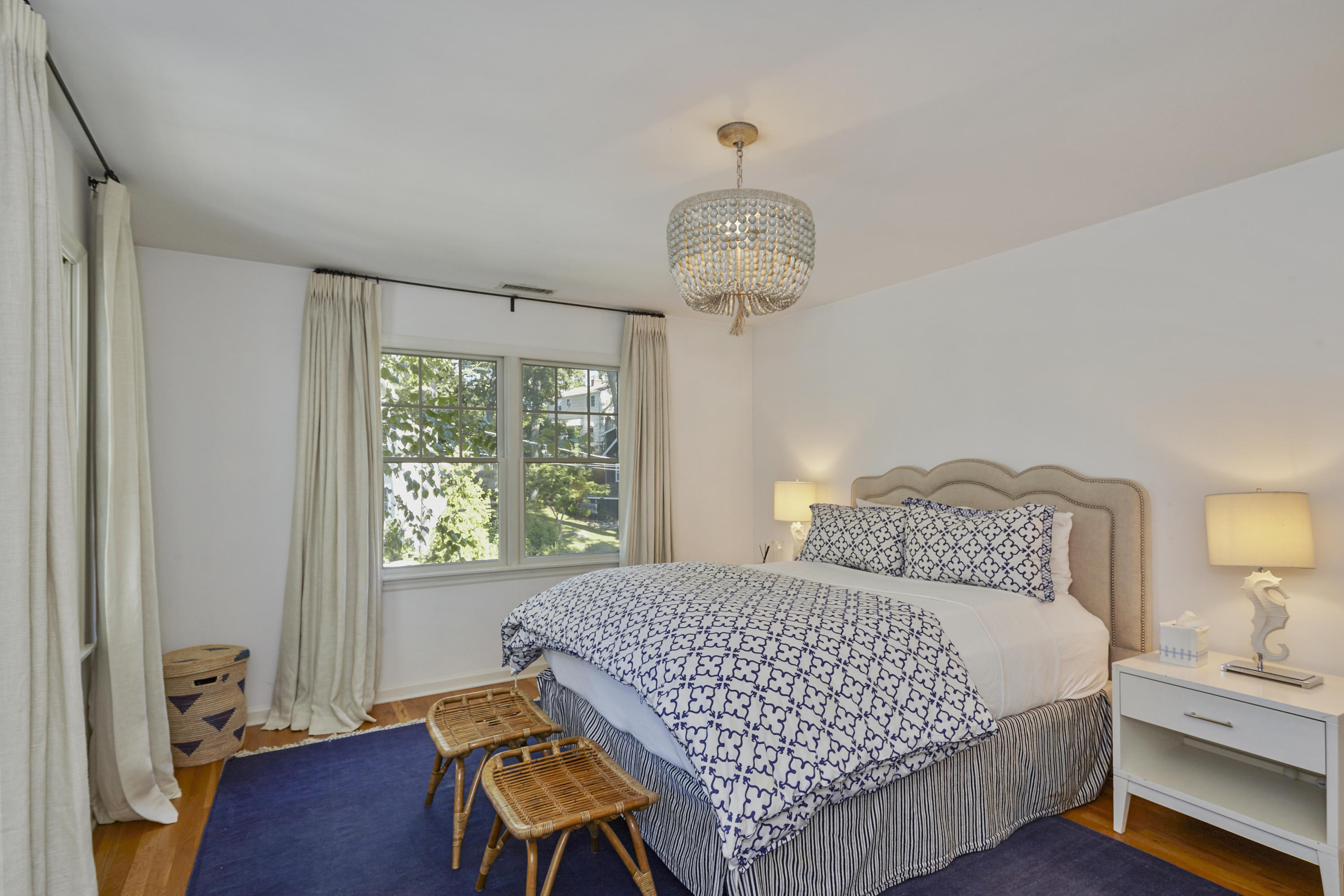 14 Richmond Road Rowayton, CT 06853 - Photo 15 of 28 a bedroom with a bed and a table in it