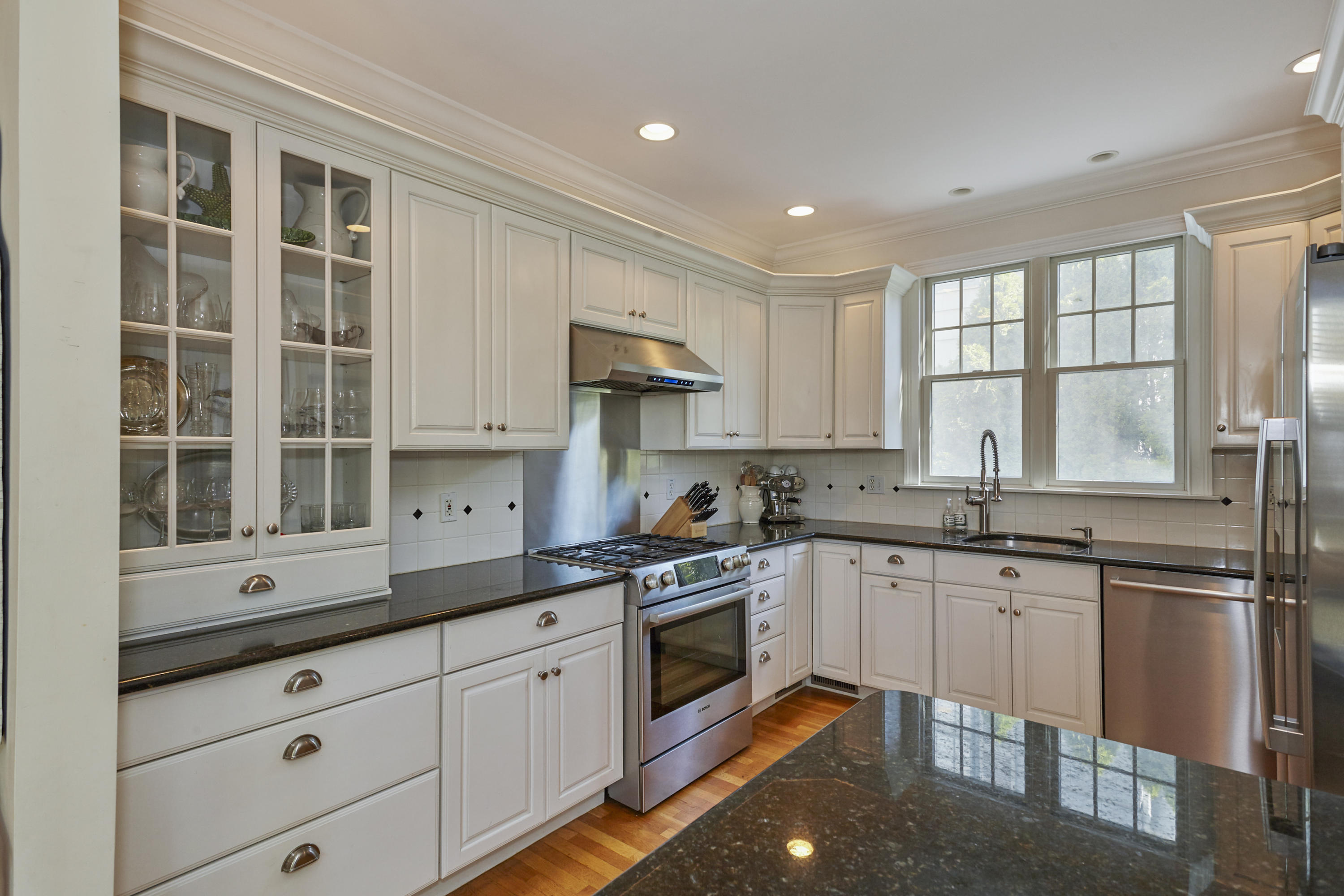 14 Richmond Road Rowayton, CT 06853 - Photo 7 of 28 a kitchen with a sink stove and cabinets