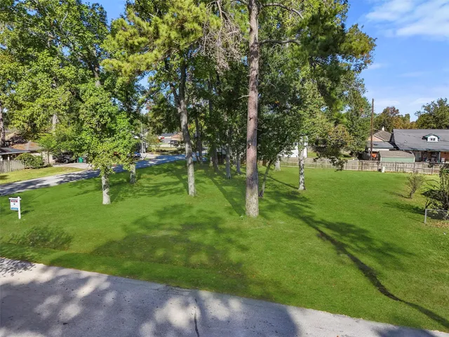 a backyard of a house with a table and chairs