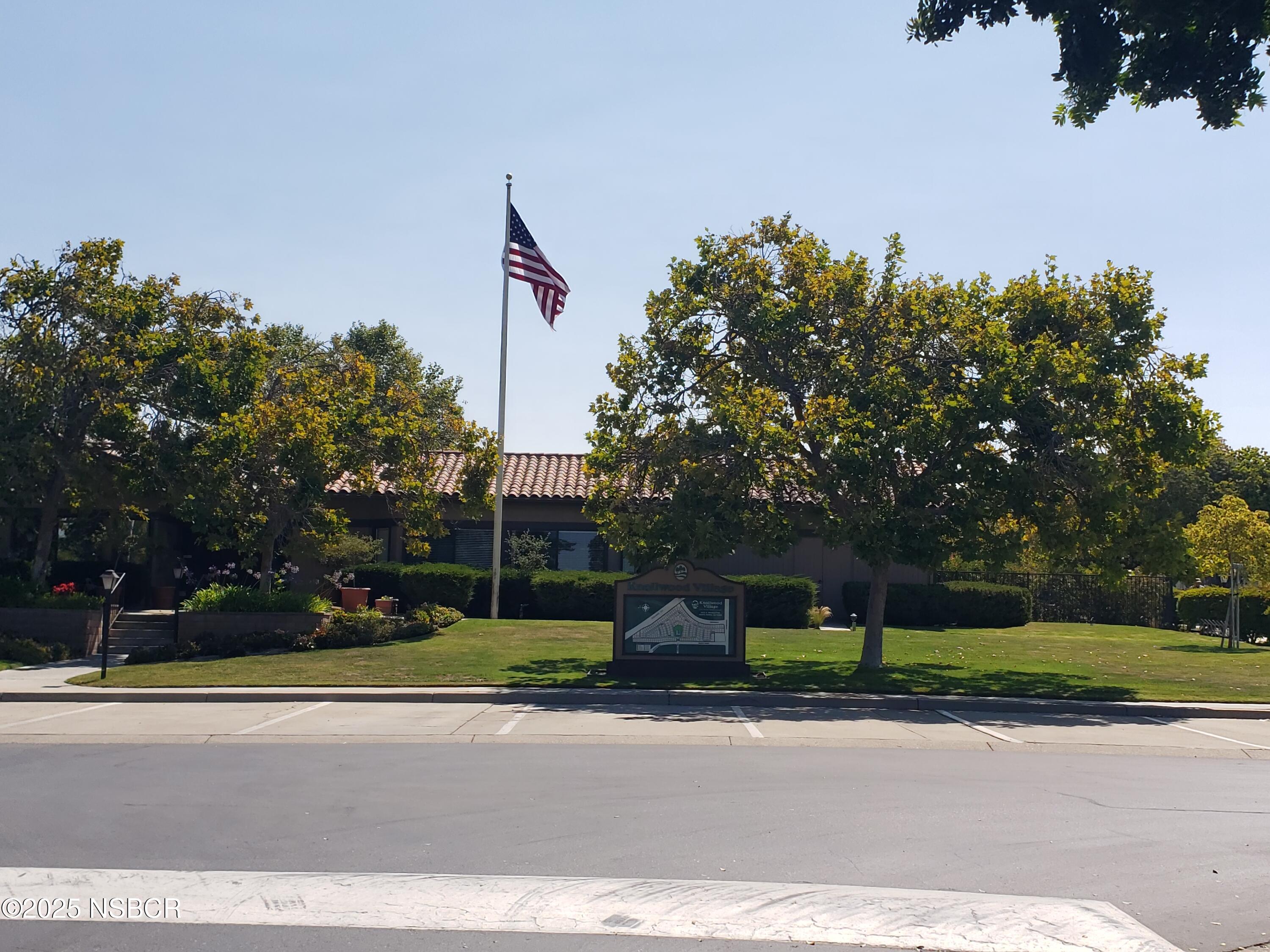 3822 Cherry Hill Road Santa Maria, CA 93455 - Photo 7 of 22 a front view of a house with a yard and a tree