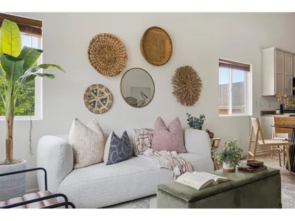 a living room with patio couch and a window