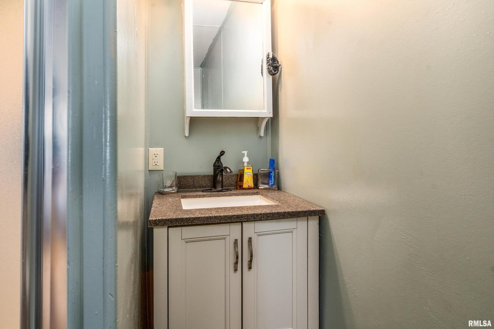 306 South Madison Street Marion, IL 62959 - Photo 19 of 37 a kitchen with a sink and cabinets