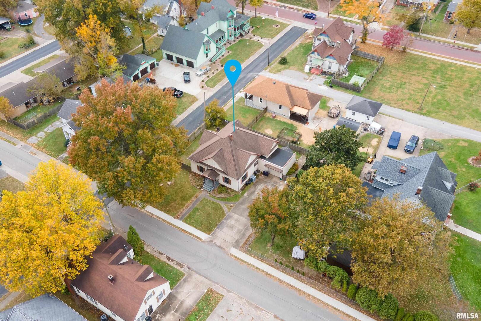 306 South Madison Street Marion, IL 62959 - Photo 33 of 37 an aerial view of a house with a yard and lake view