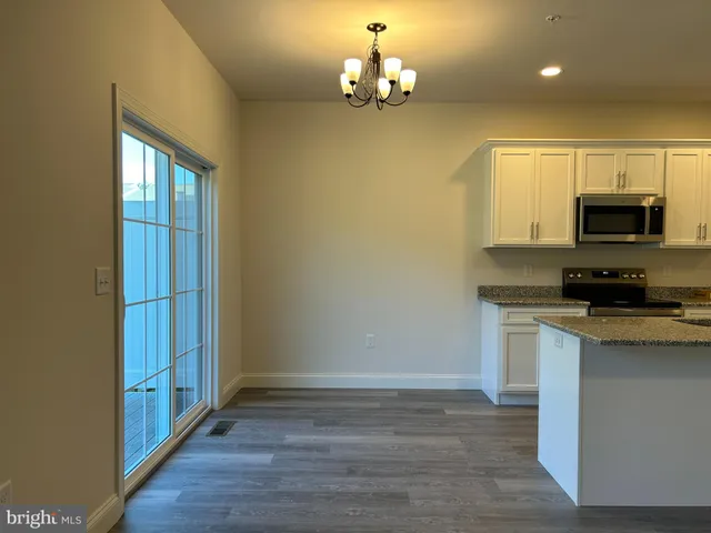 a kitchen with a stove and a microwave