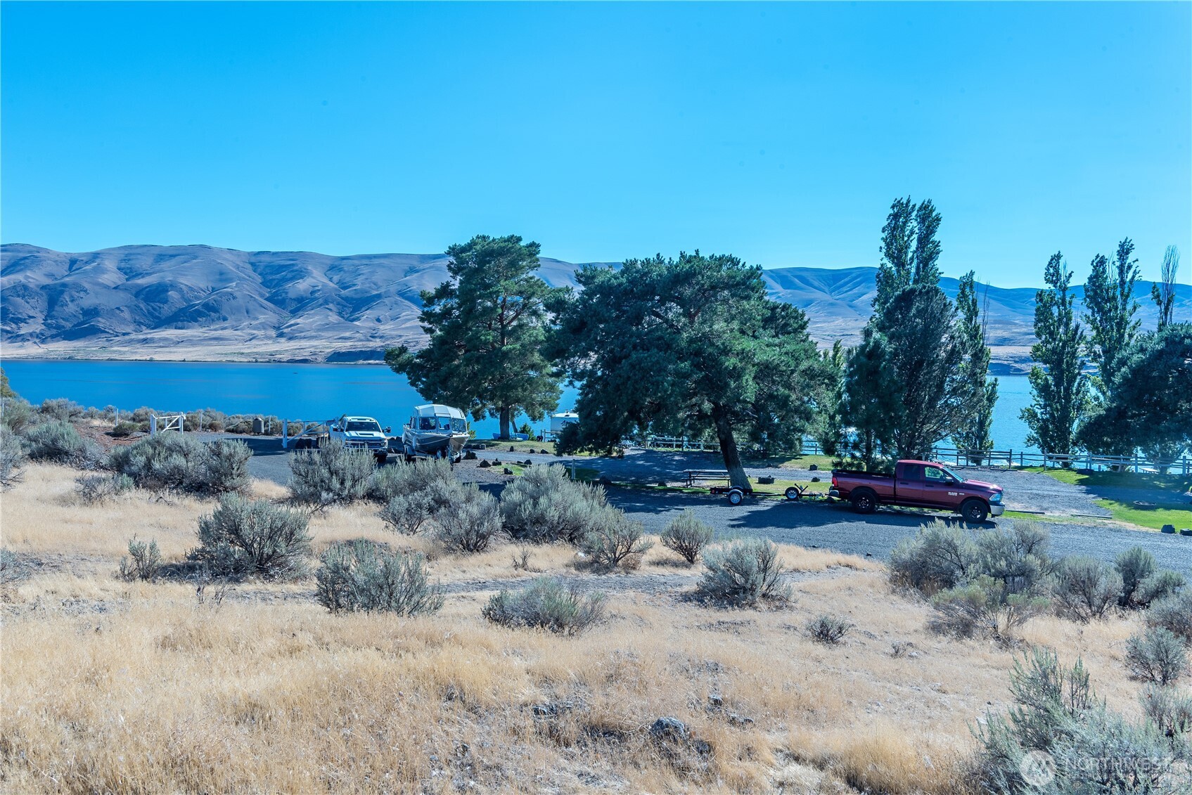 602 Edgewater Way South Mattawa, WA 99349 - Photo 14 of 25 a view of a fire pit with large trees