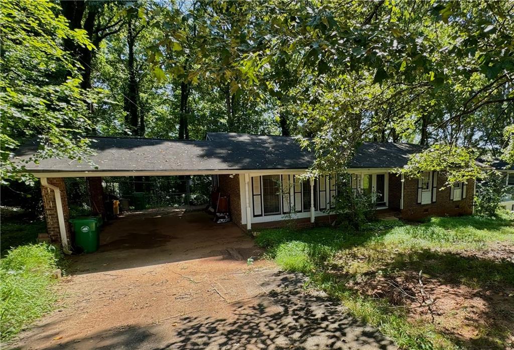 2304 Sterling Ridge Road Decatur, GA 30032 - Photo 1 of 1 a backyard of a house with yard barbeque oven and outdoor seating