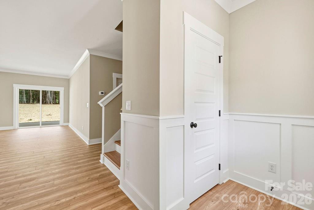 1020 Baylor Grove Road, Unit 20 Monroe, NC 28112 - Photo 17 of 45 a view of a hallway with wooden floor and staircase