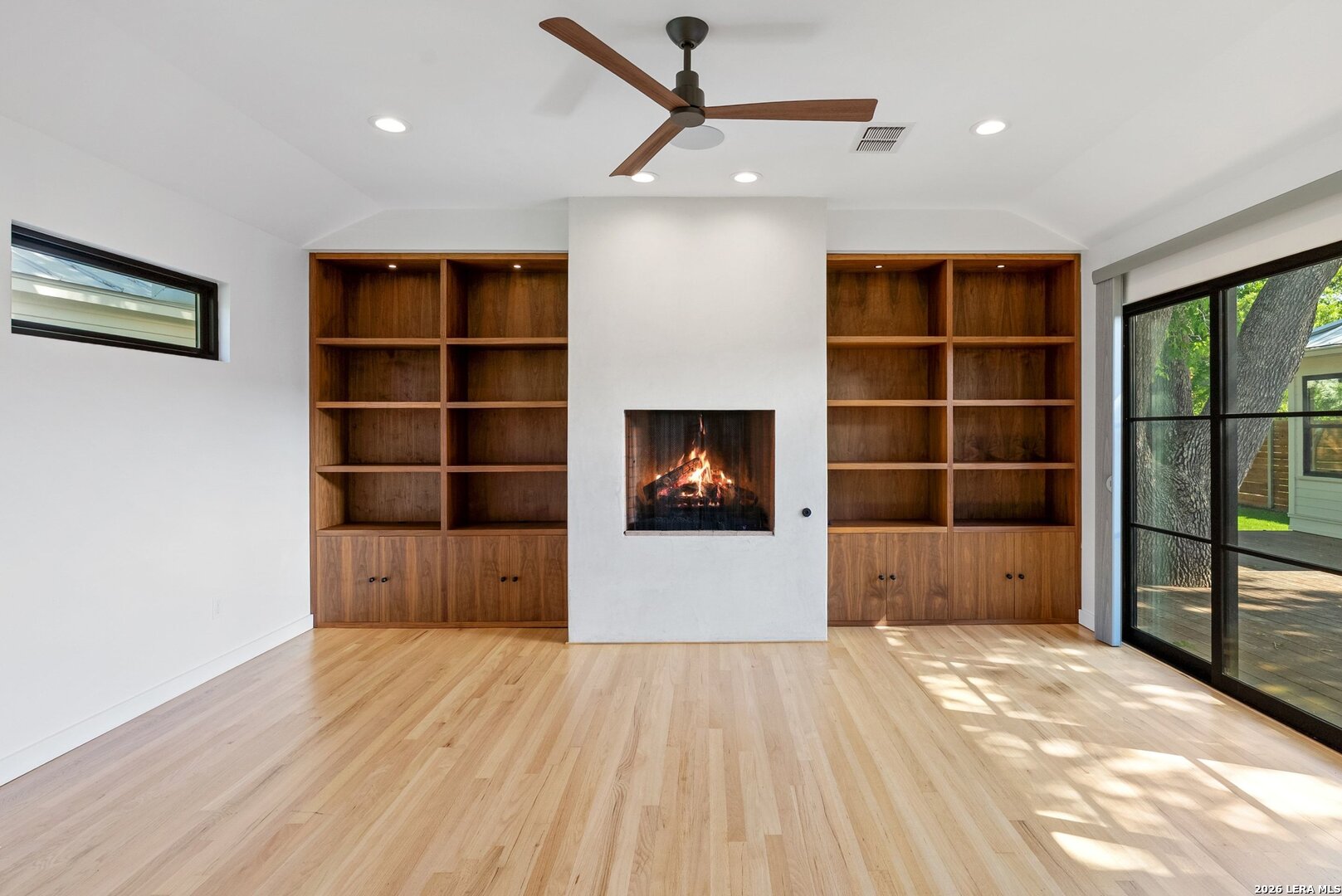 1402 Hutto Road Georgetown, TX 78626 - Photo 23 of 34 a view of empty room with wooden floor and a window