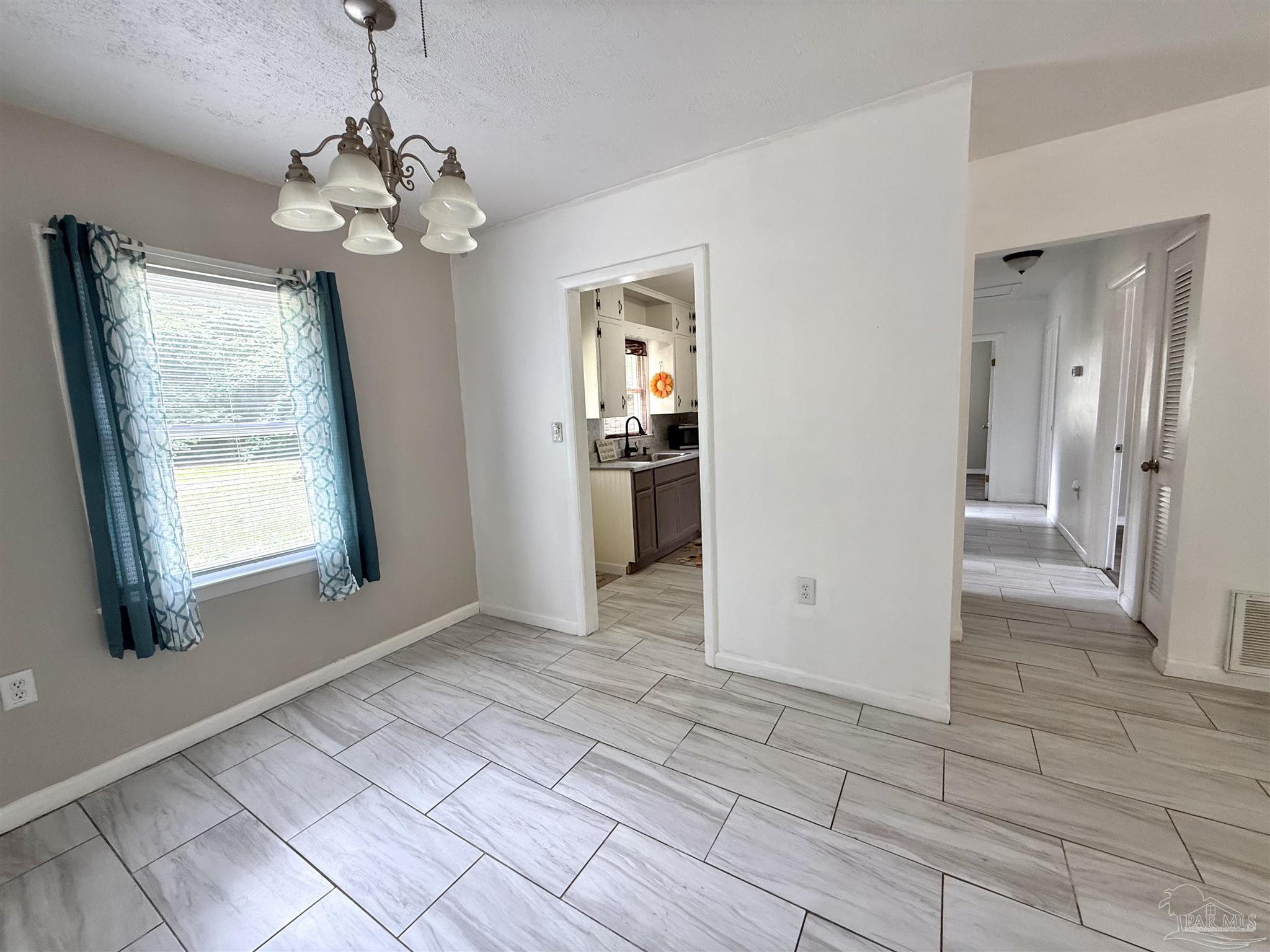 6443 Walnut Street Milton, FL 32570 - Photo 6 of 22 Dining area with a window view.