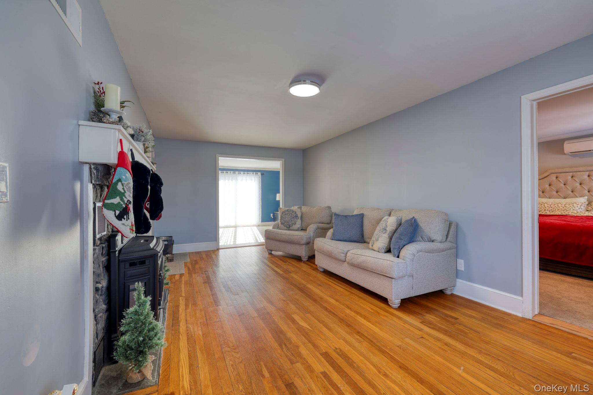 210 Overlook Road Poughkeepsie, NY 12603 - Photo 11 of 43 Living area featuring light wood-style floors and a wall unit AC