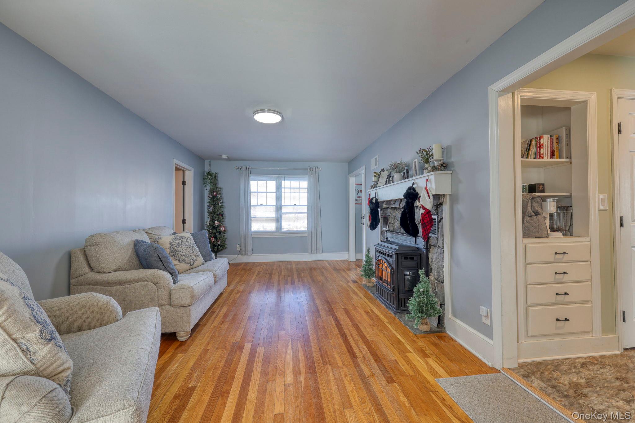 210 Overlook Road Poughkeepsie, NY 12603 - Photo 12 of 43 Living area featuring light wood-style flooring and a wood stove