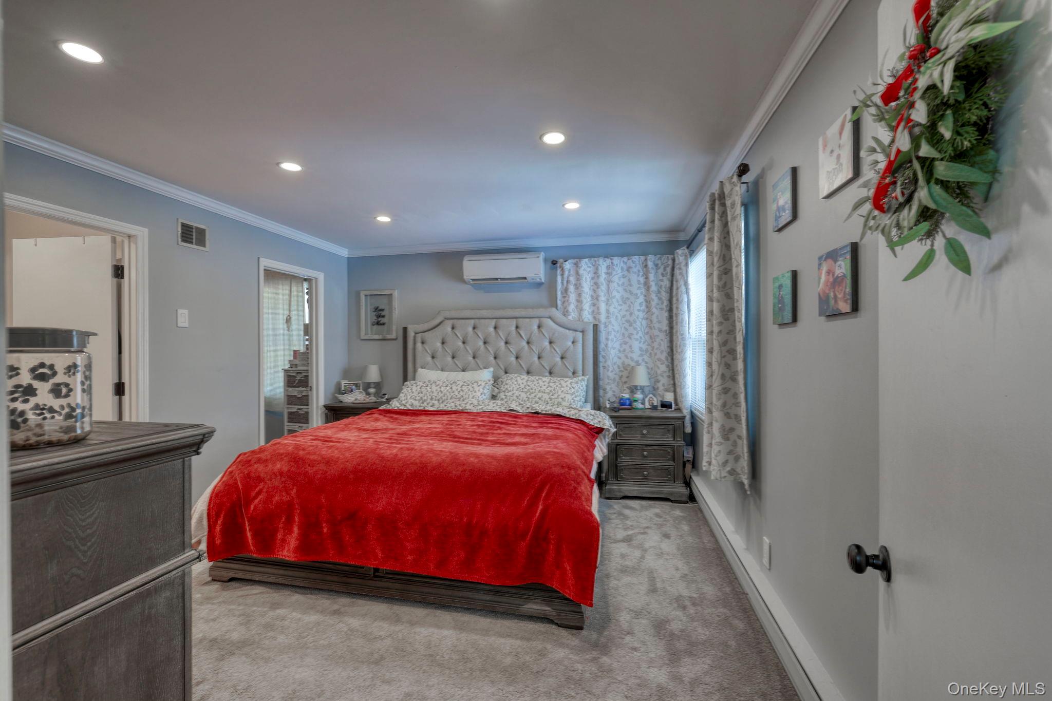 210 Overlook Road Poughkeepsie, NY 12603 - Photo 13 of 43 Carpeted bedroom with baseboard heating, ornamental molding, recessed lighting, and an AC wall unit