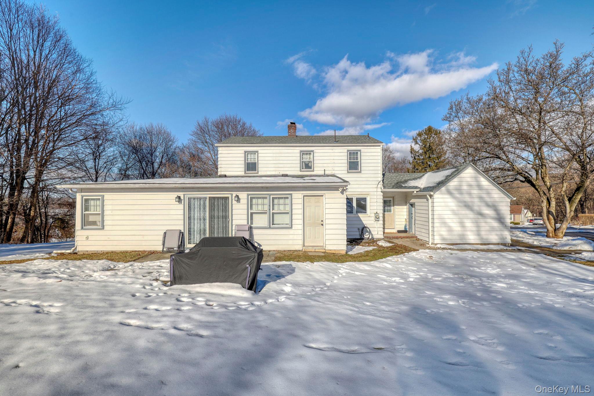 210 Overlook Road Poughkeepsie, NY 12603 - Photo 33 of 43 Snow covered property featuring a chimney and a patio