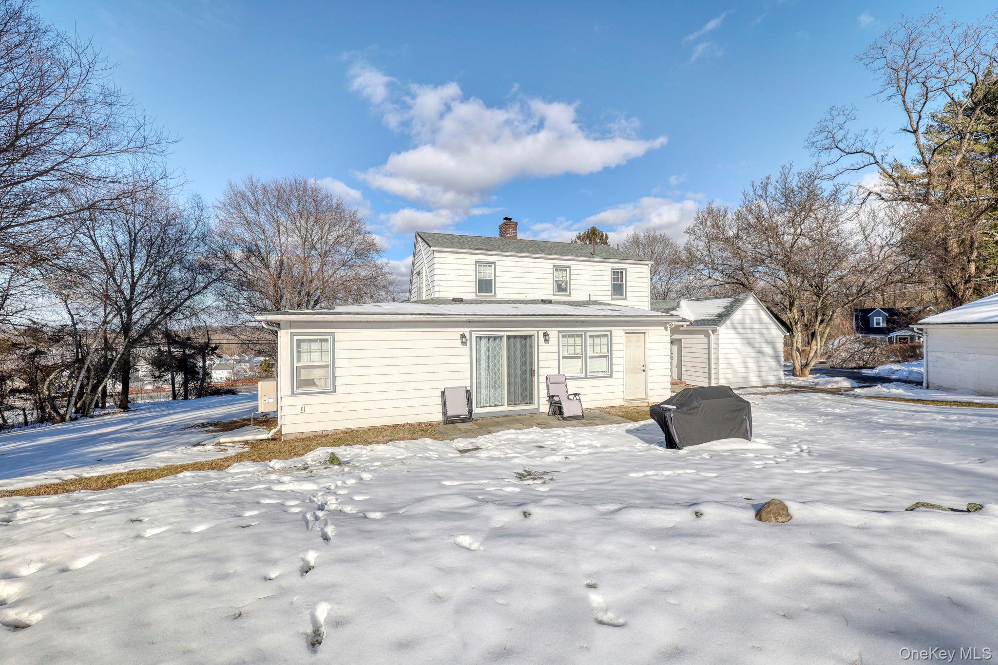 210 Overlook Road Poughkeepsie, NY 12603 - Photo 34 of 43 Snow covered back of property featuring a chimney