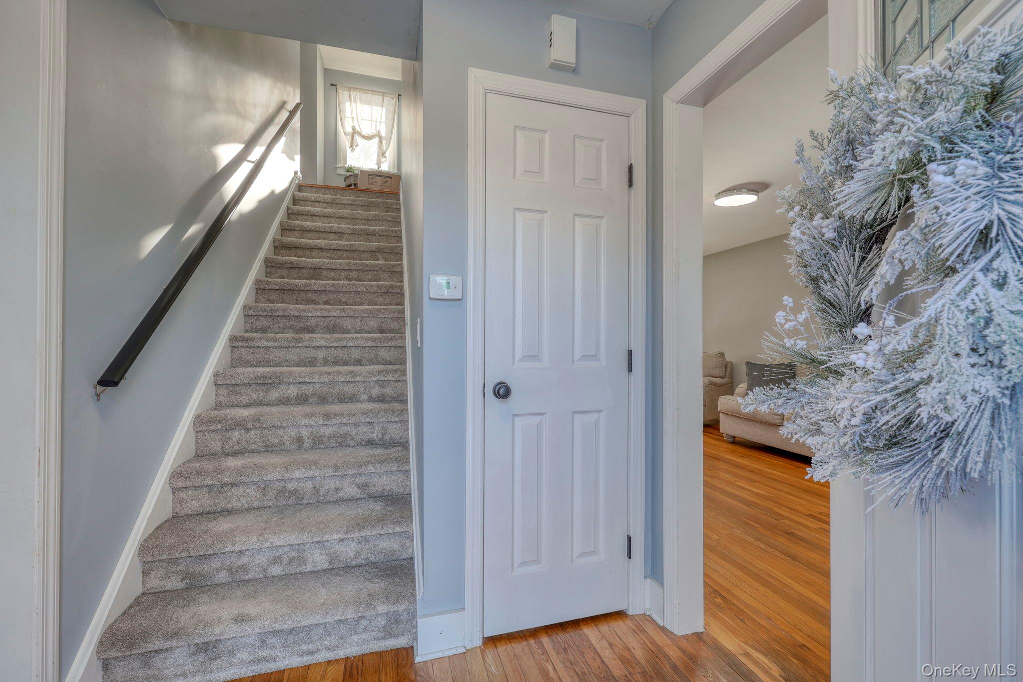 210 Overlook Road Poughkeepsie, NY 12603 - Photo 43 of 43 Stairway featuring wood finished floors and baseboards