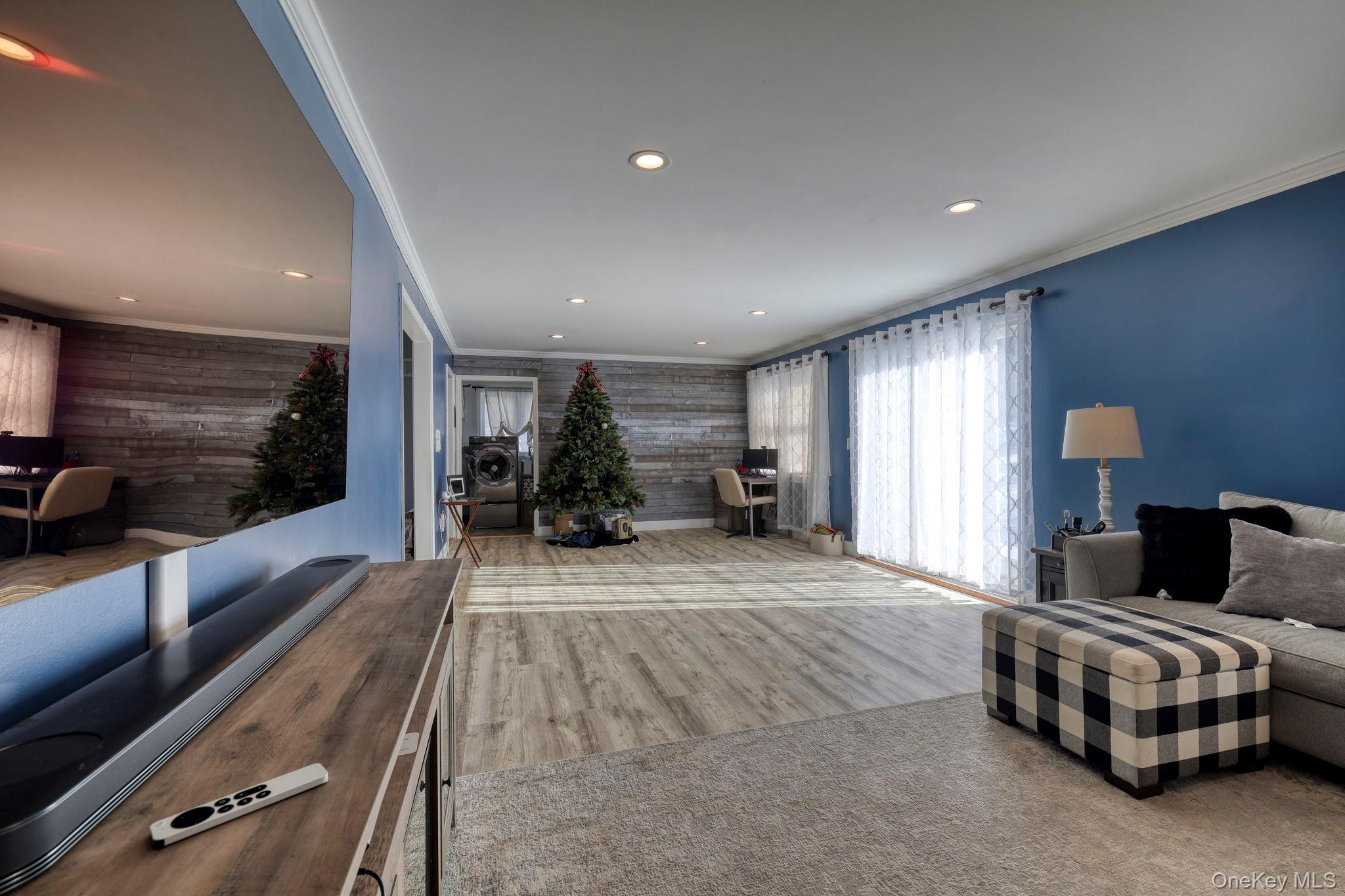 210 Overlook Road Poughkeepsie, NY 12603 - Photo 6 of 43 Living area with crown molding, wood finished floors, and recessed lighting