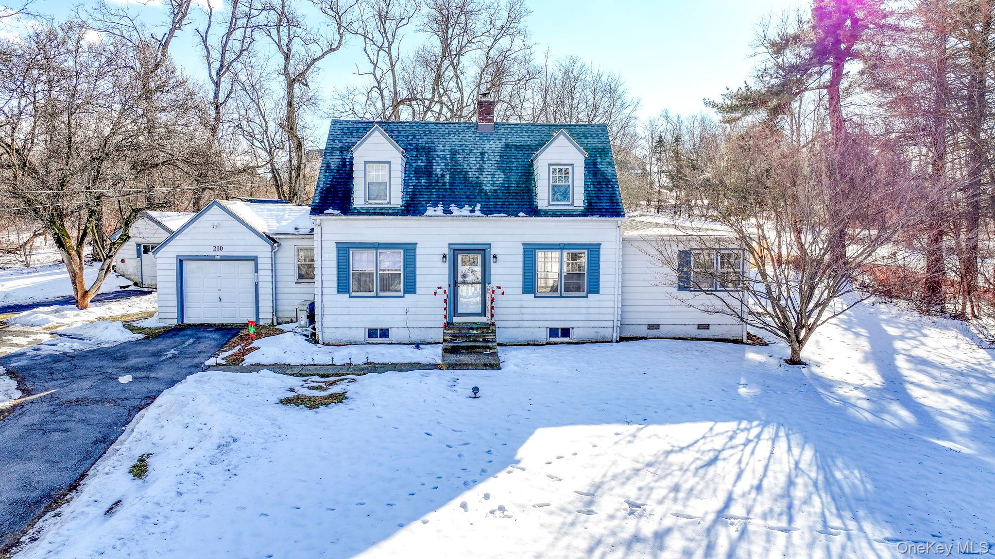 210 Overlook Road Poughkeepsie, NY 12603 - Photo 9 of 43 Cape cod-style house with a chimney, asphalt driveway, an attached garage, and roof with shingles