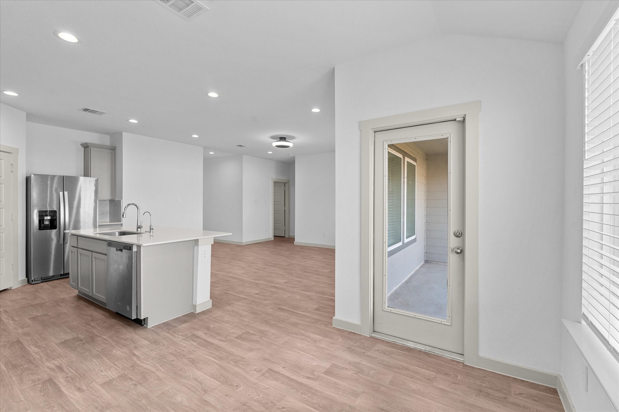 8102 Buck Lane Rosharon, TX 77583 - Photo 14 of 26 a view of a kitchen with refrigerator and white cabinets