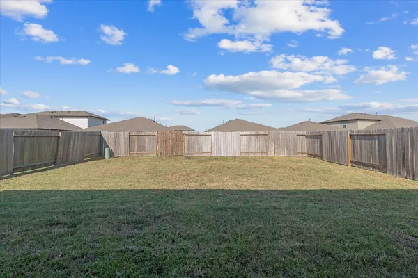 a swimming pool with wooden fence
