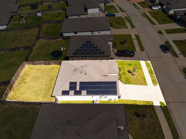 an aerial view of residential houses with outdoor space