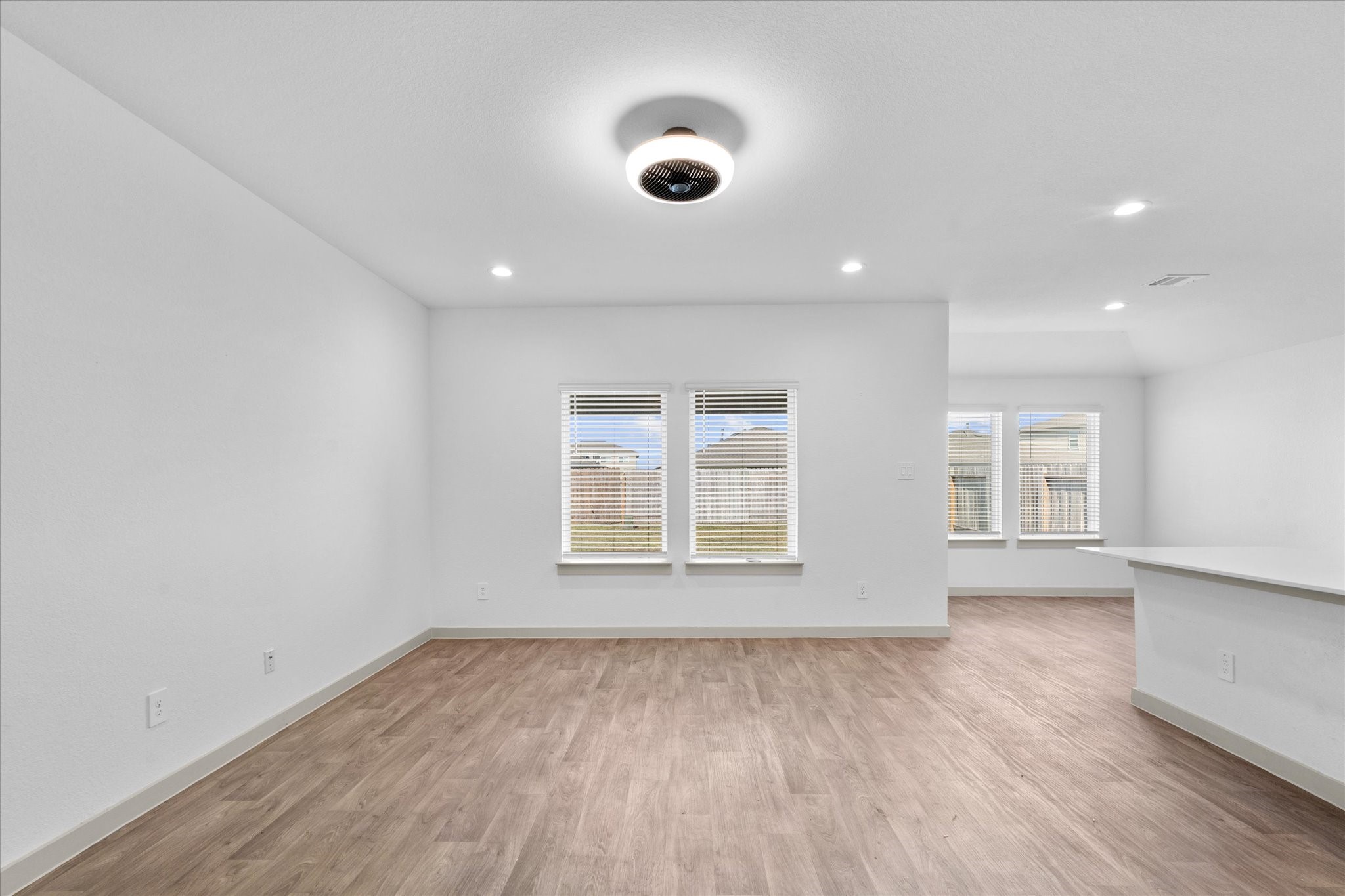 8102 Buck Lane Rosharon, TX 77583 - Photo 7 of 26 an empty room with wooden floor and windows