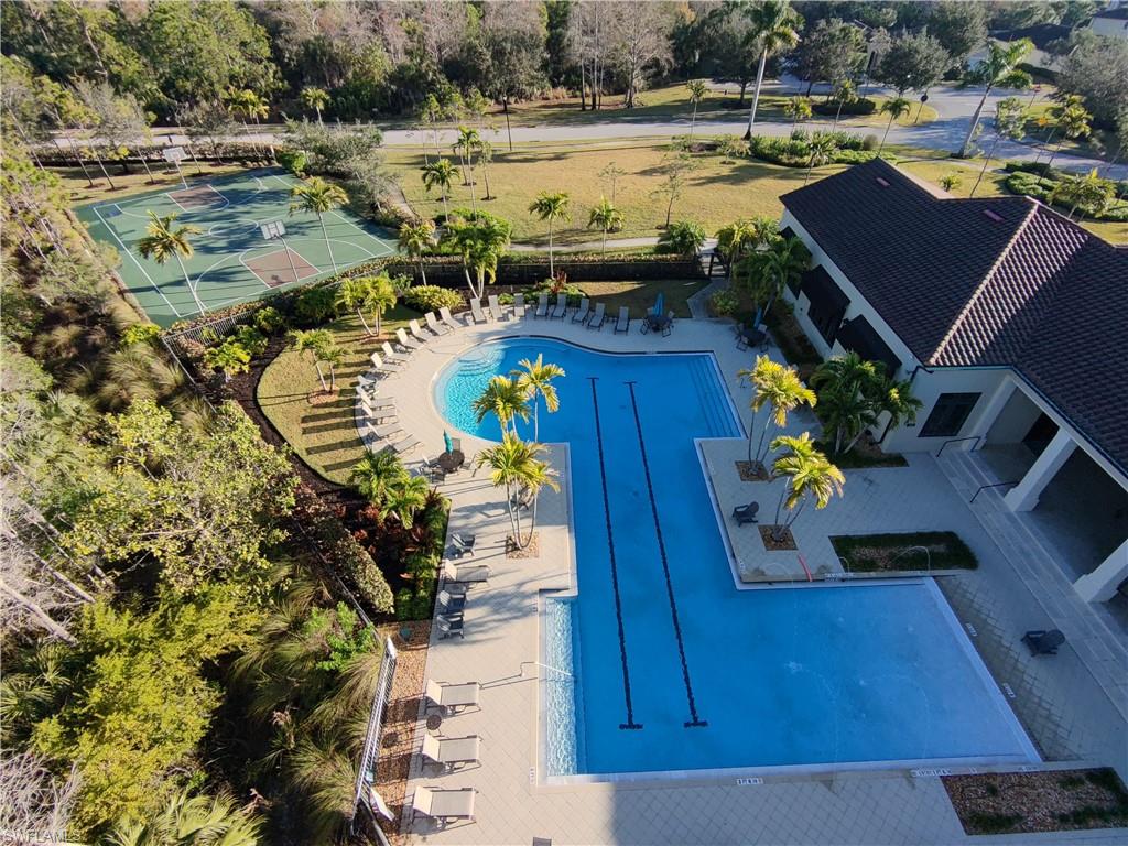 4284 Raffia Palm Circle Naples, FL 34119 - Photo 24 of 50 Community pool with a patio