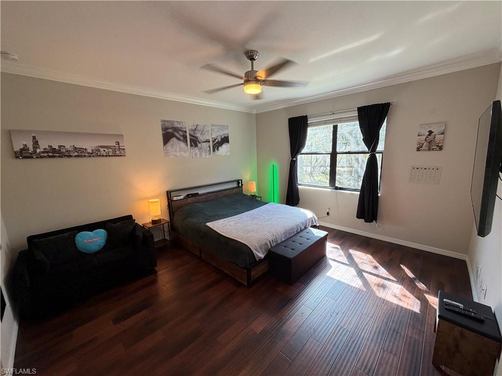 4284 Raffia Palm Circle Naples, FL 34119 - Photo 26 of 50 Master bedroom with hardwood / wood-style flooring, ornamental molding, and ceiling fan