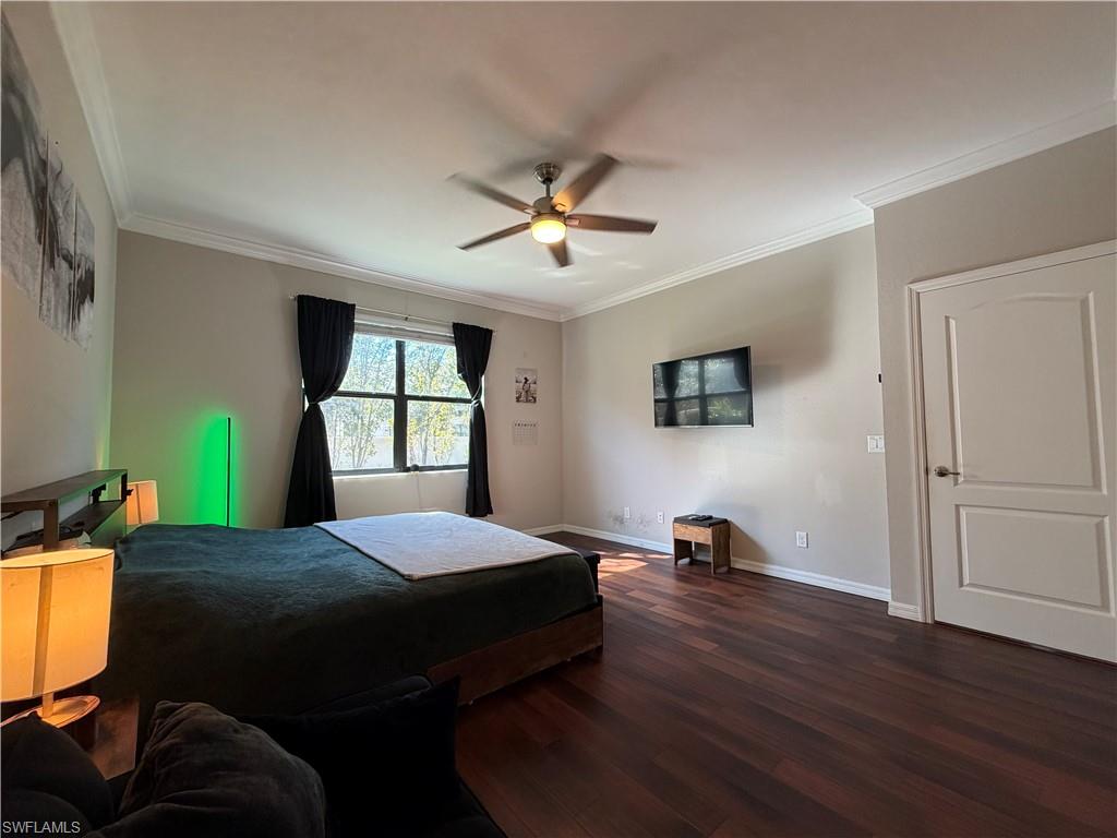 4284 Raffia Palm Circle Naples, FL 34119 - Photo 29 of 50 Master Bedroom with dark wood-type flooring, ornamental molding, and a ceiling fan