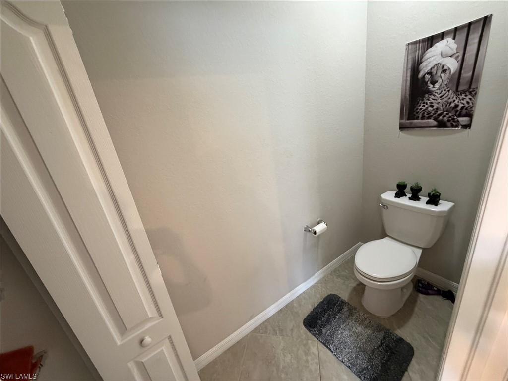 4284 Raffia Palm Circle Naples, FL 34119 - Photo 39 of 50 Bathroom featuring toilet and tile patterned floors