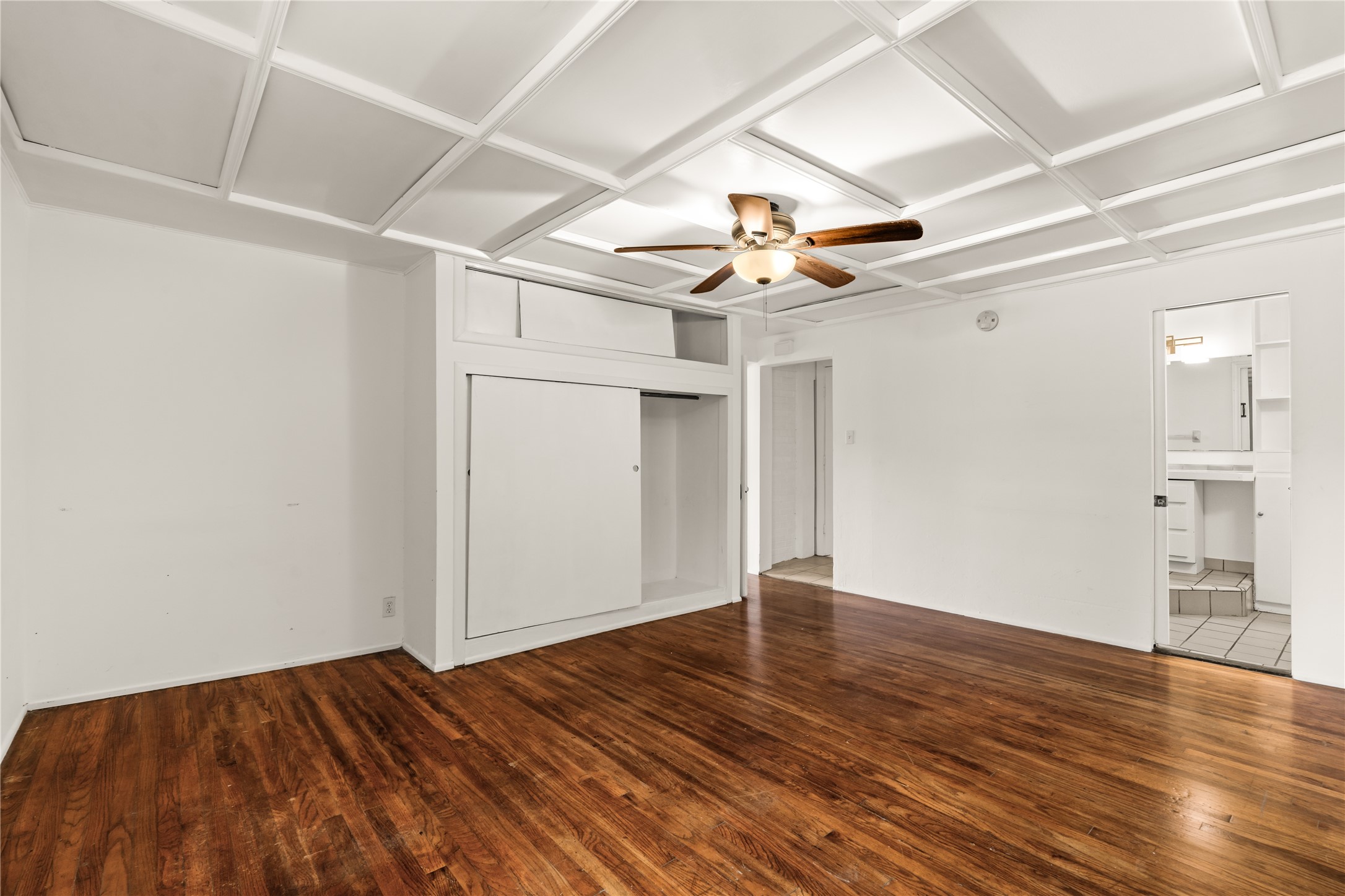 2202 West Main Street Houston, TX 77098 - Photo 16 of 32 a view of an empty room with wooden floor