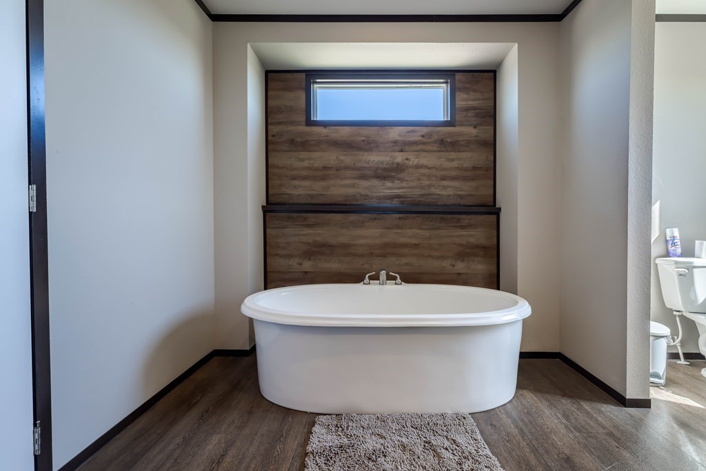 192 Chuckwagon Trail Harper, TX 78631 - Photo 12 of 23 a white toilet sitting in a bathroom