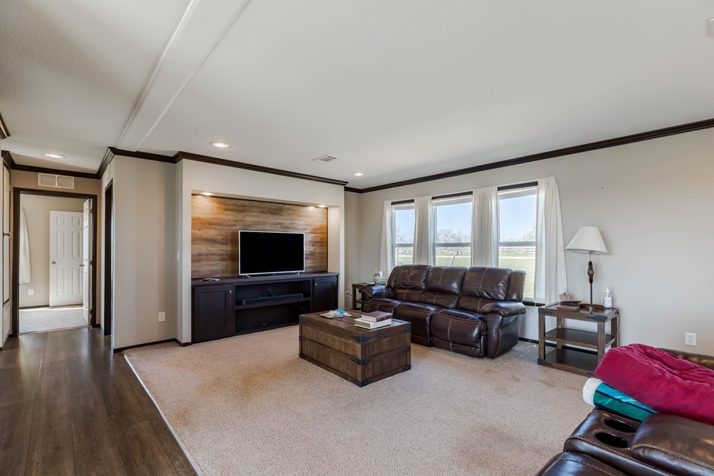 192 Chuckwagon Trail Harper, TX 78631 - Photo 3 of 23 a living room with furniture and a flat screen tv