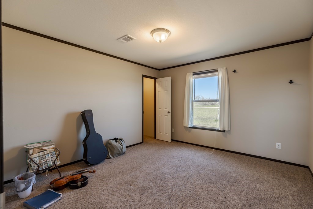 192 Chuckwagon Trail Harper, TX 78631 - Photo 5 of 23 a view of a room with gym equipment