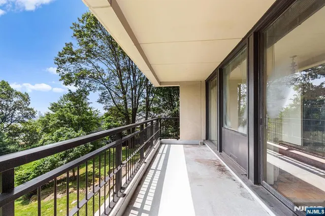 a view of balcony with wooden floor