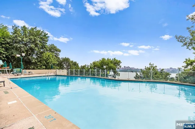 a view of a water pond with an outdoor seating