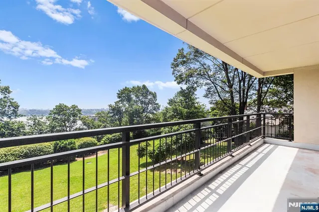 a view of balcony with lots of trees