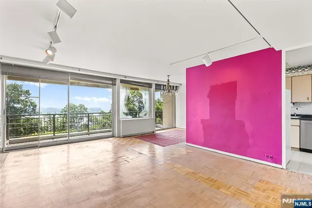 a view of empty room with floor to ceiling window