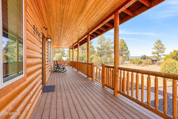 a view of balcony with wooden floor