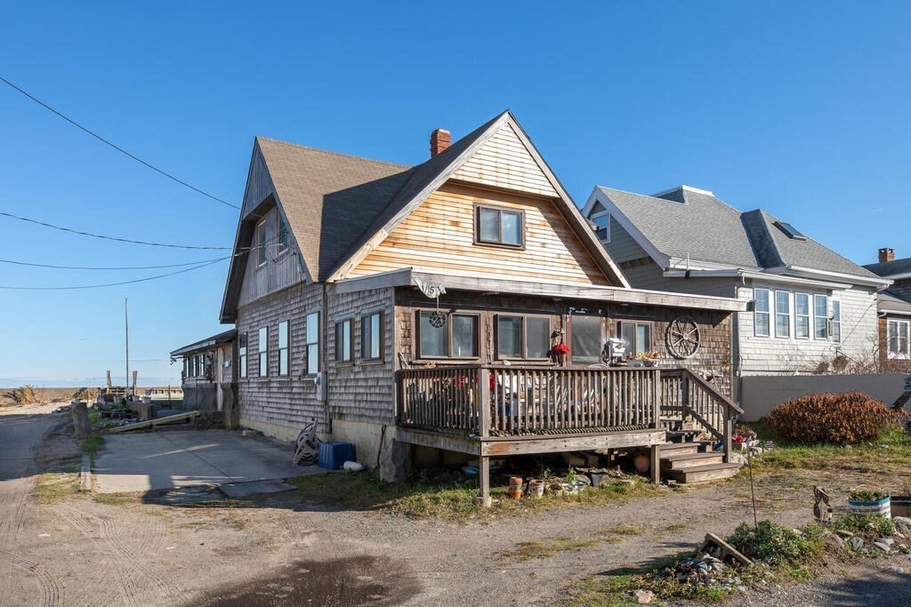 121 The Strand Winthrop, MA 02152 - Photo 2 of 13 a view of a house with wooden deck front of house