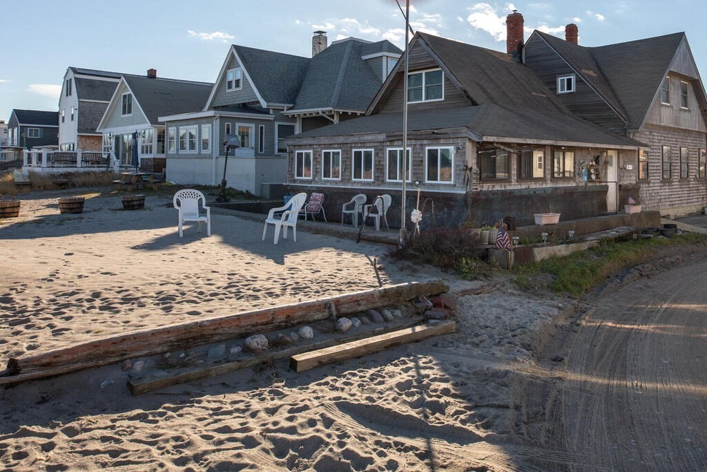 121 The Strand Winthrop, MA 02152 - Photo 10 of 13 a view of a big house with wooden fence