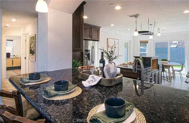 a kitchen with a dining table and chairs