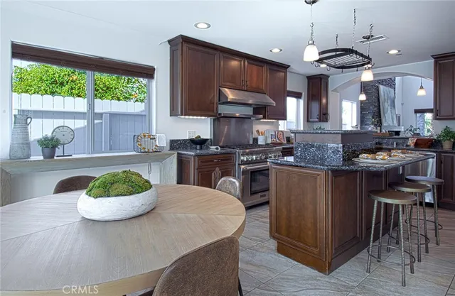 a kitchen with a table and chairs