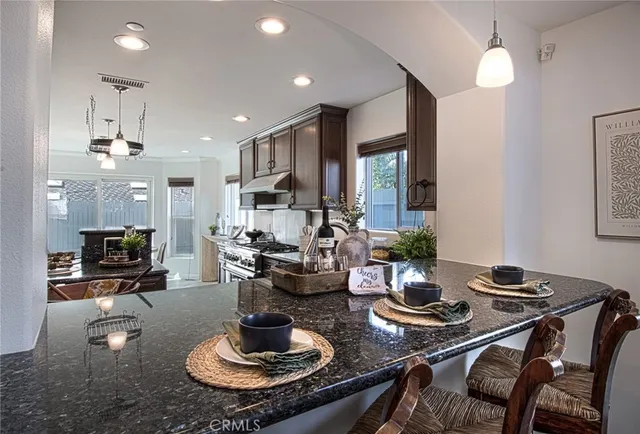 a kitchen with a table and chairs in it