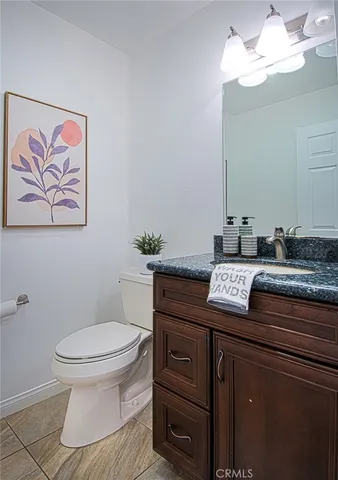 a bath room with a toilet and a sink